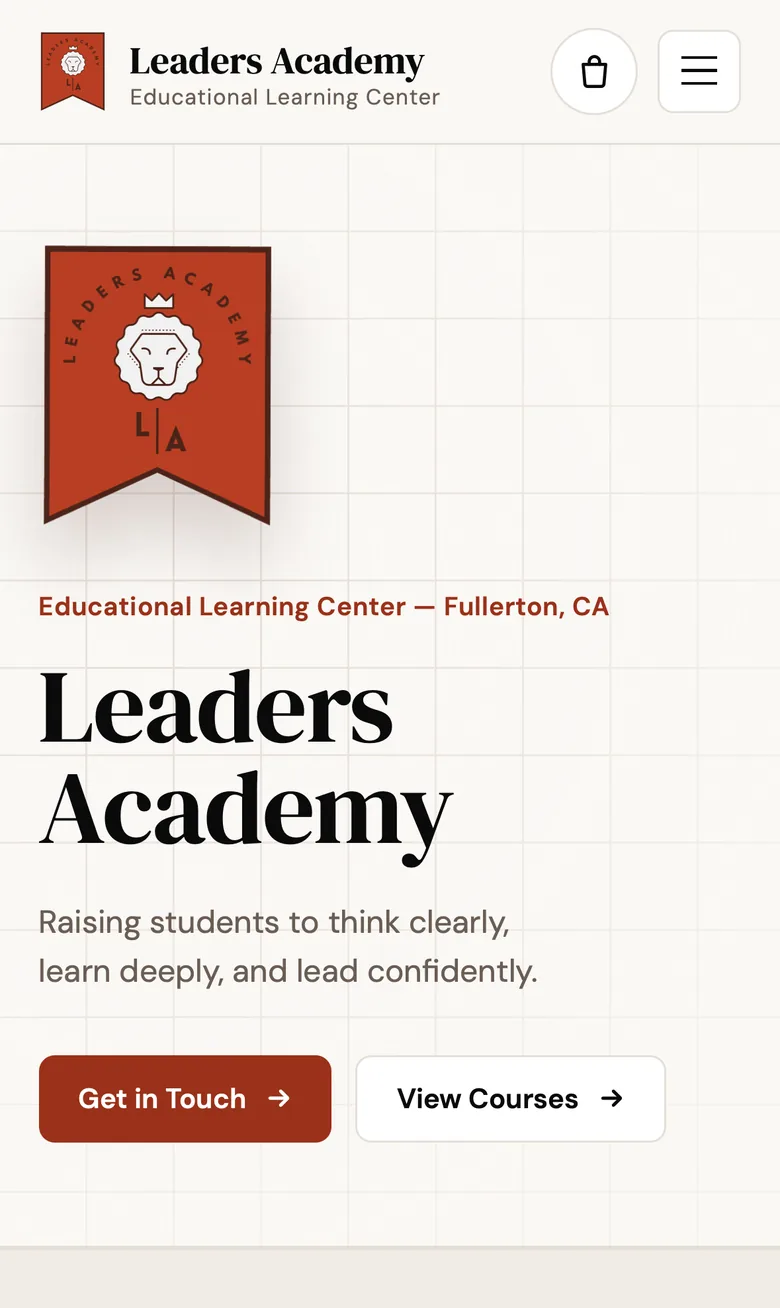 Leaders Academy home page on an iPhone.